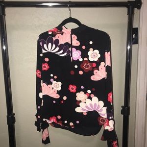 A very cute black,pink,red and white blouse.